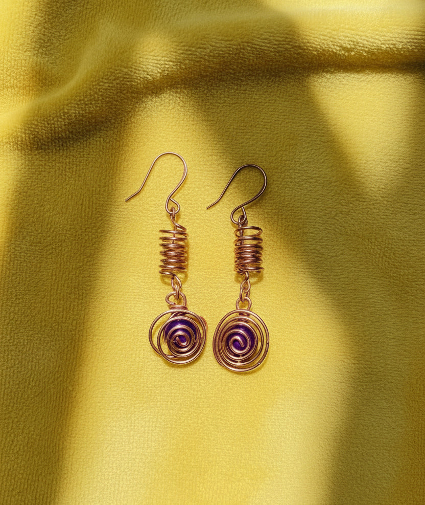 Copper spiral earrings with amethysts