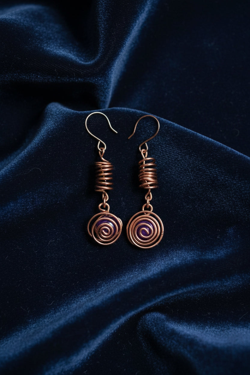 Copper spiral earrings with amethysts